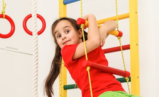 7 years old child playing on sports equipment