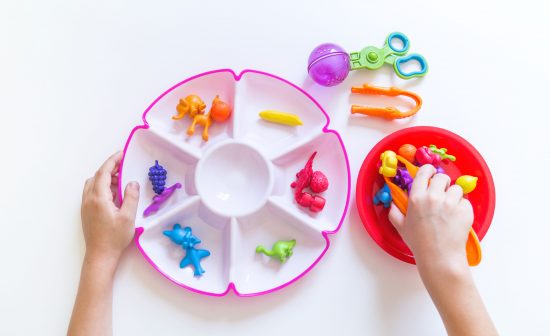 Montessori material. Children's hands. The study of mathematics and color. School and kindergarten.